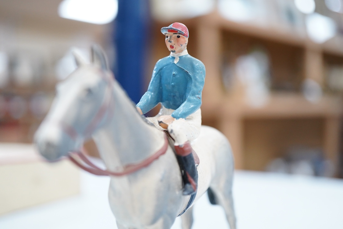 Two boxed Britains Racing Colours of Famous Owners series lead mounted figures; Lord Astor - rider in blue jersey with a pink sash on a grey horse (one leg broken and missing), and. the Duke of Norfolk - rider in blue je